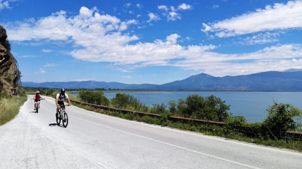 two mtb cyclists riding next to the prespa lake