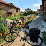 bike with century old houses in the background in prespa area