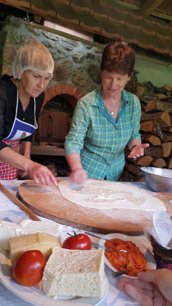 two women preparing pie