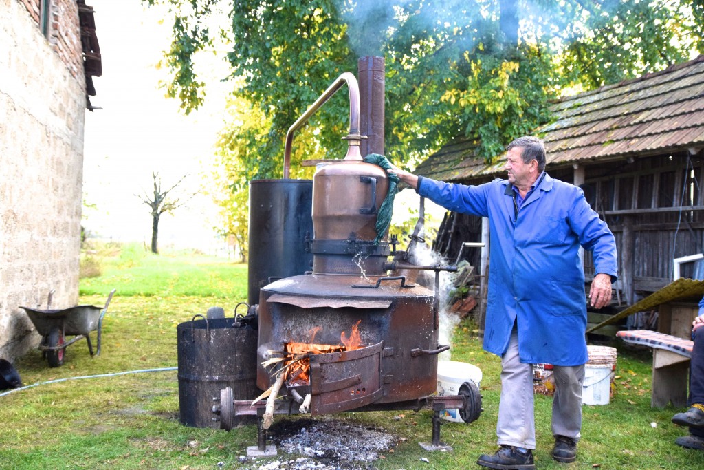 man with distillater for making rakia spirit and wine