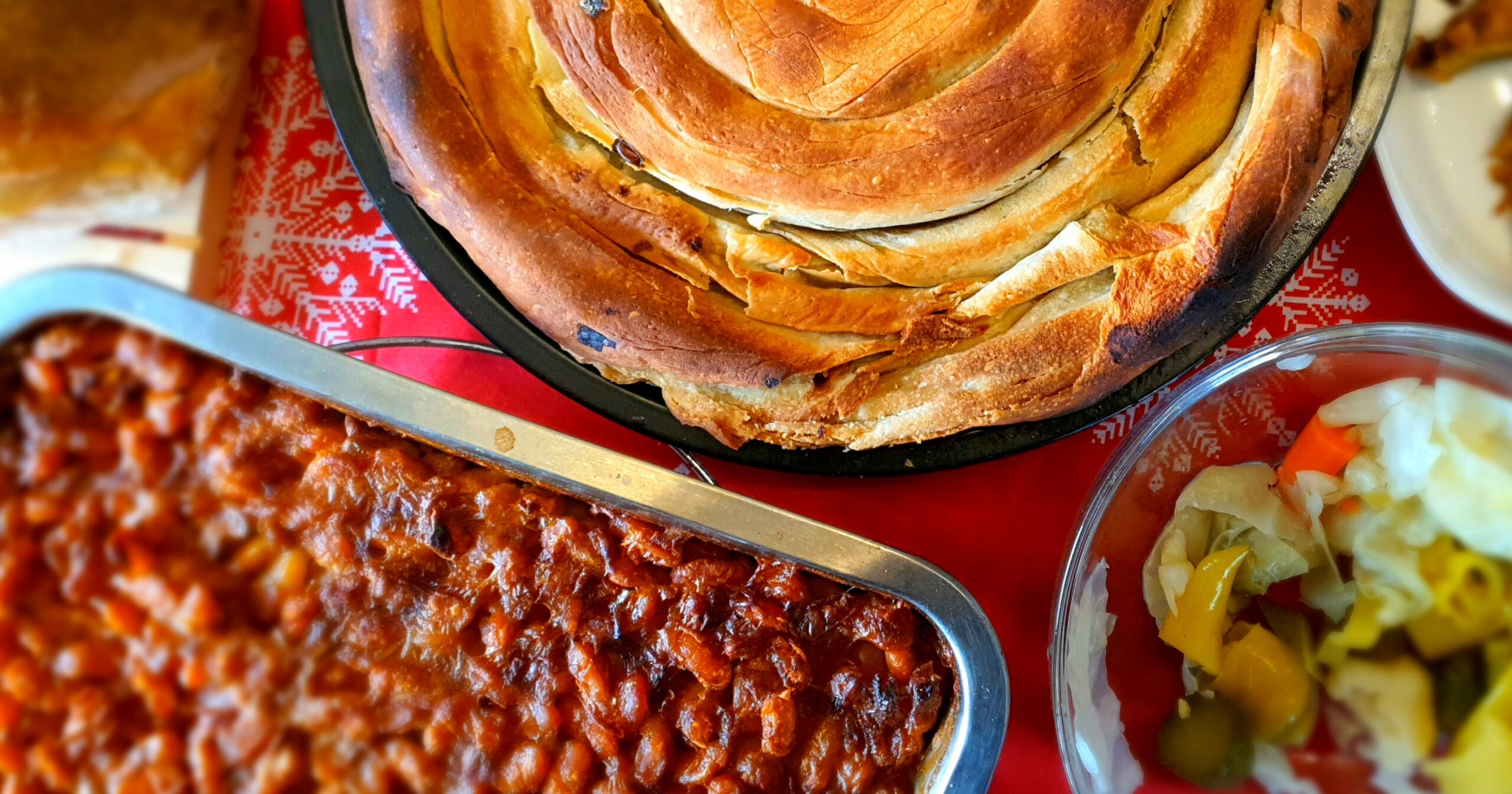 pie with bean casserole and pickled vegetables